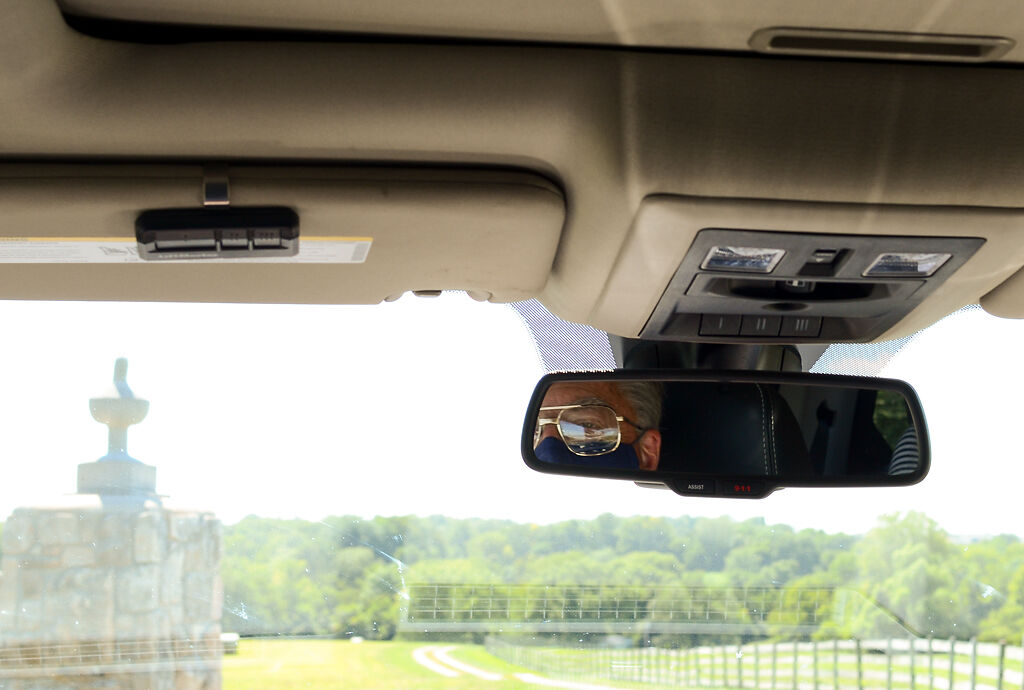 Denny Stephenson drives through his farmland property